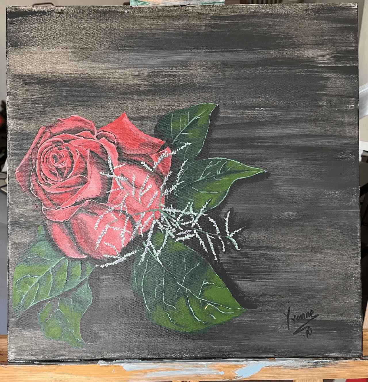 A painting of a rose on wood